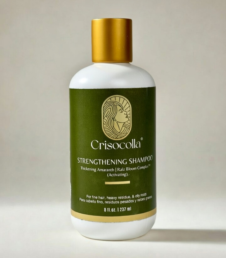 Crisocollo BotaniBloom plant based strengthening shampoo bottle with gold cap on a light background