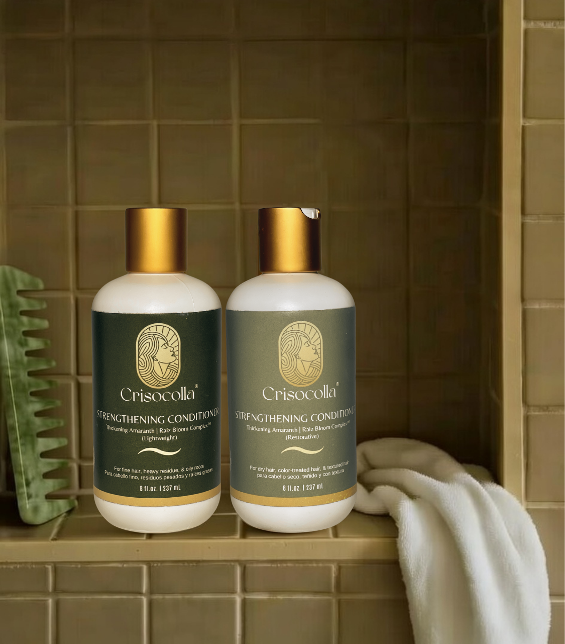 Two bottles of Crisocolla BotaniBloom plant based strengthening conditioner on a tiled shelf with a comb and towel. For hair growth